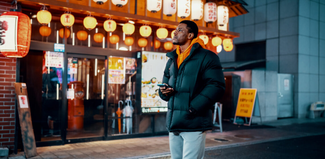 Mid adult man exploring Japanese night life